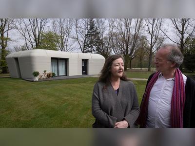 A 3D printed home shaped like a boulder has just got its first tenants