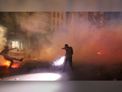 Beirut blast demonstrators get past riot police and tear gas, smash front of minister’s home