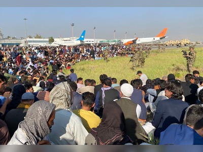 Chaos at Kabul airport continues as crowds try to flee Afghanistan