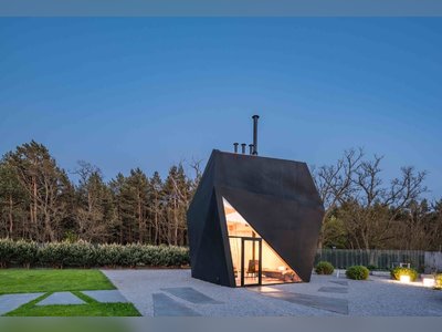 A Family in Poland Adds an Origami-Inspired Retreat to Their Backyard