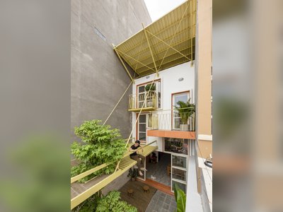 Cascading Levels Bring Light and Air Into a Narrow Home in Vietnam