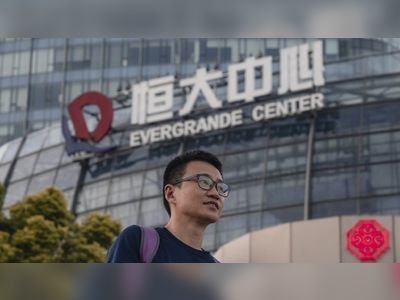 Evergrande shares rise on report of bond interest payment