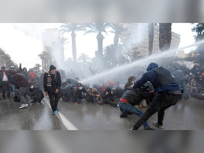 Tunisia police use water cannon to disperse protesters