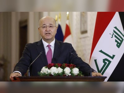 Iraq president encourages early elections to end crisis